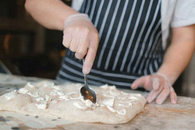 Dessert chef at Seasons pizza plating a delicious dessert